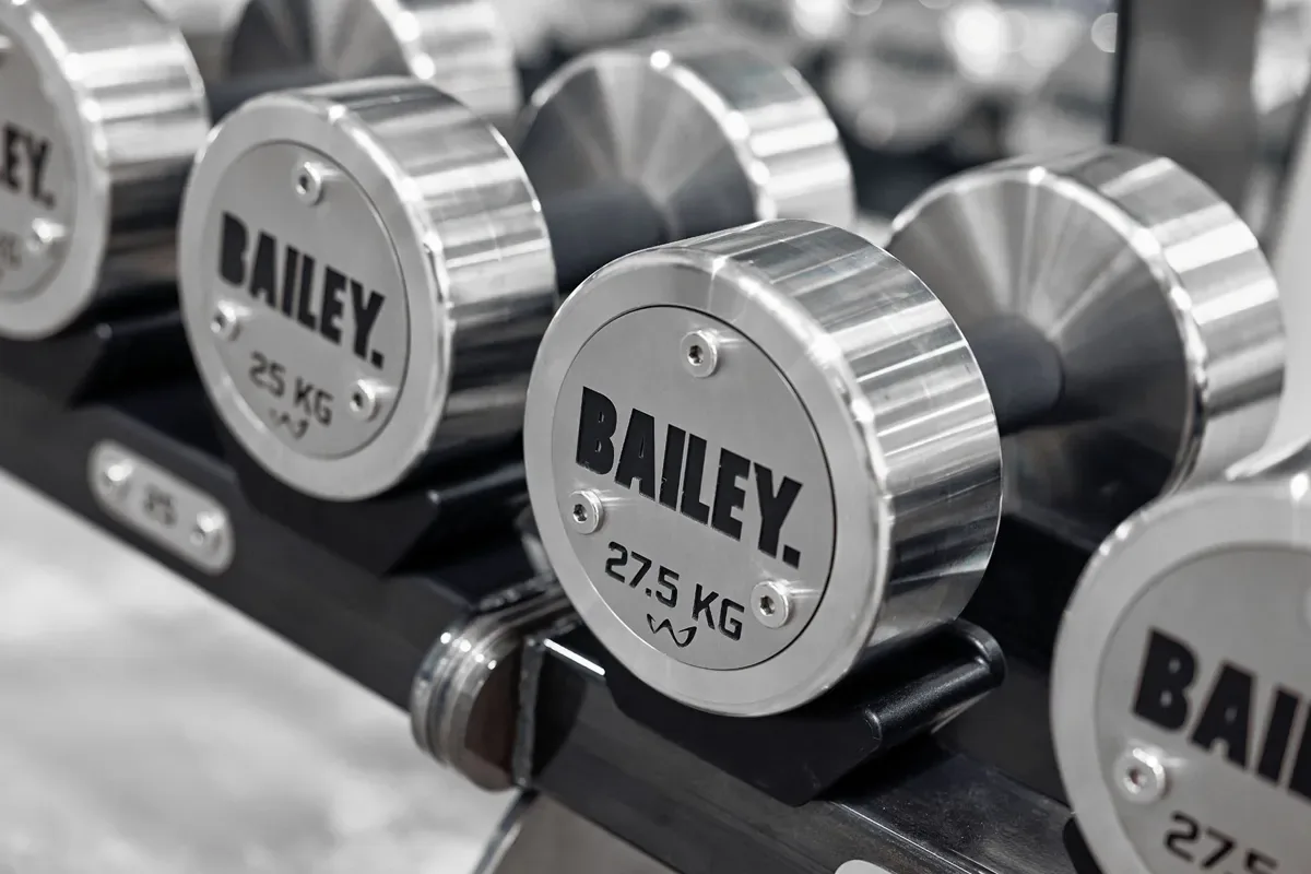 Branded Bailey dumbbells racked in The Bailey