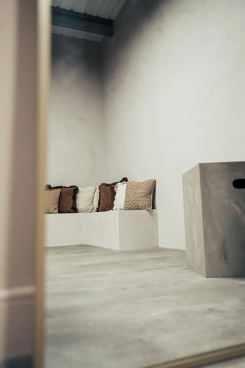 Built-in plinth seating with textured cushions in Cover Story