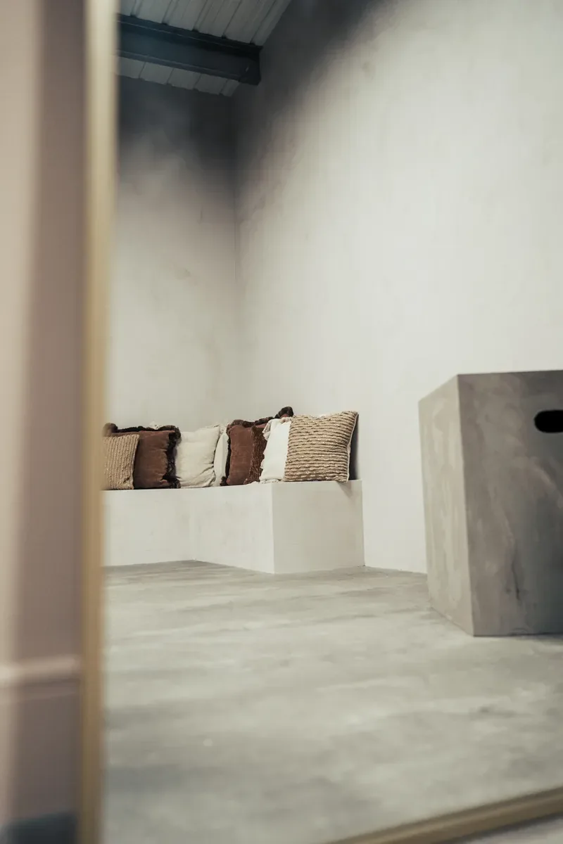Built-in plinth seating with textured cushions in Cover Story