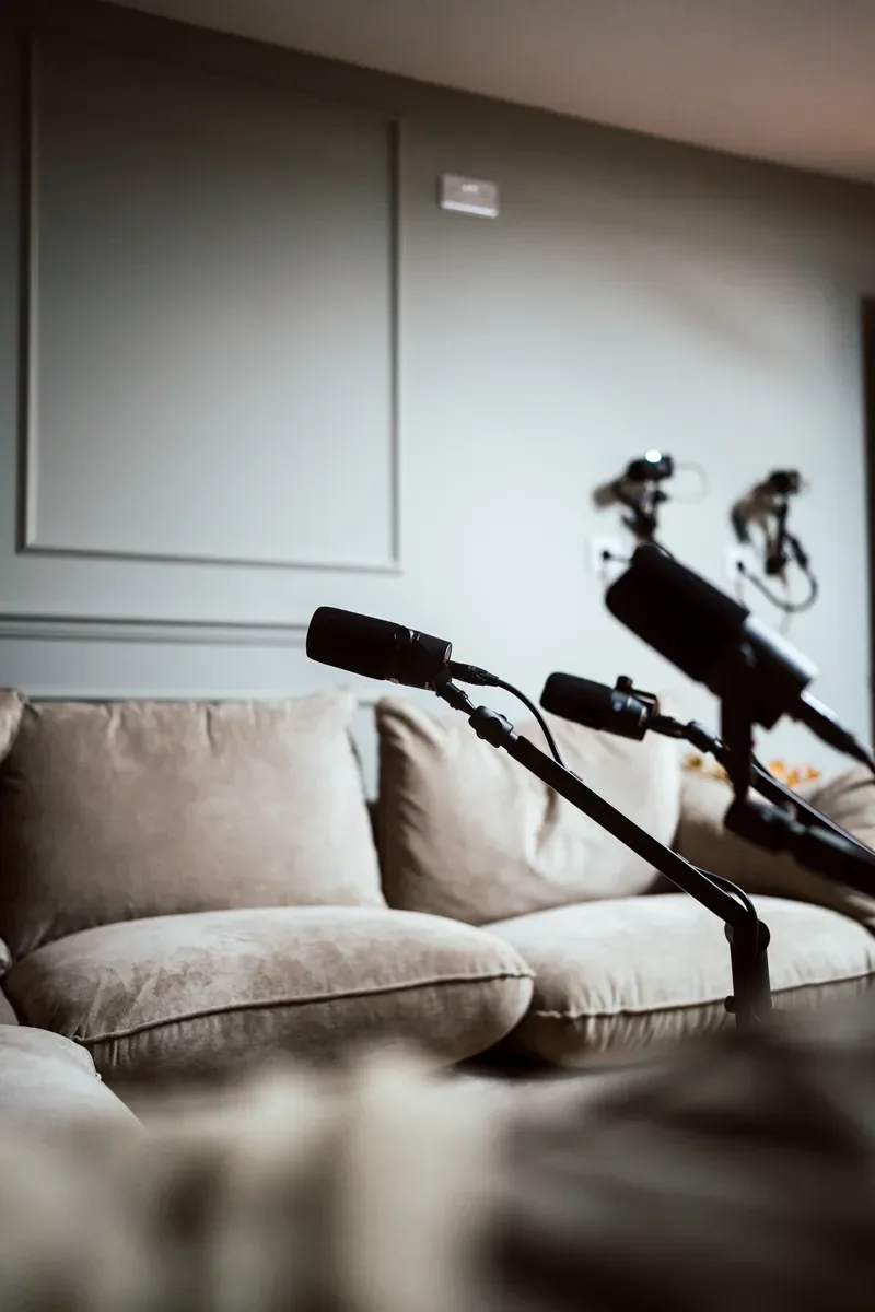 Lounge couch and boom-mounted microphones in The Gathering
