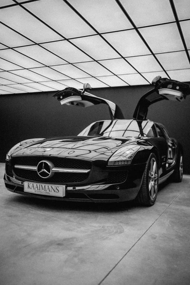 Mercedes SLS with gullwing doors open, in black and white